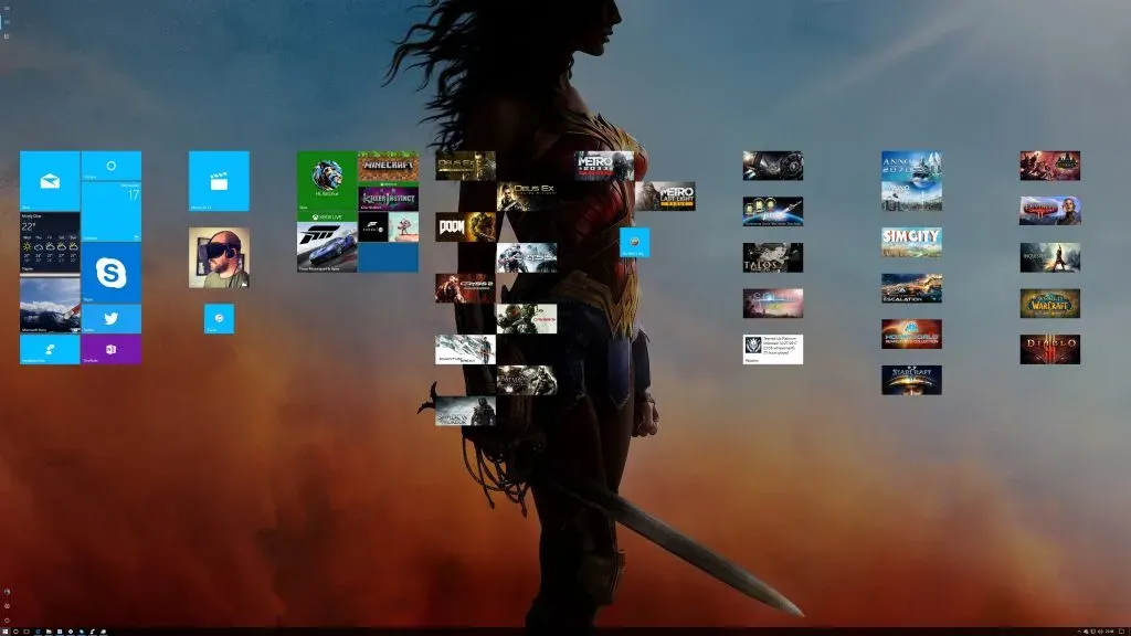Windows 10 Start Screen with tiles in narrow two-wide columns, most of the wallpaper left bare