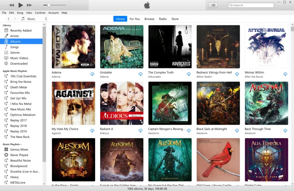 iTunes Albums grid packed with metal covers, status bar counting 1062 albums, 36 days, 108.88 GB