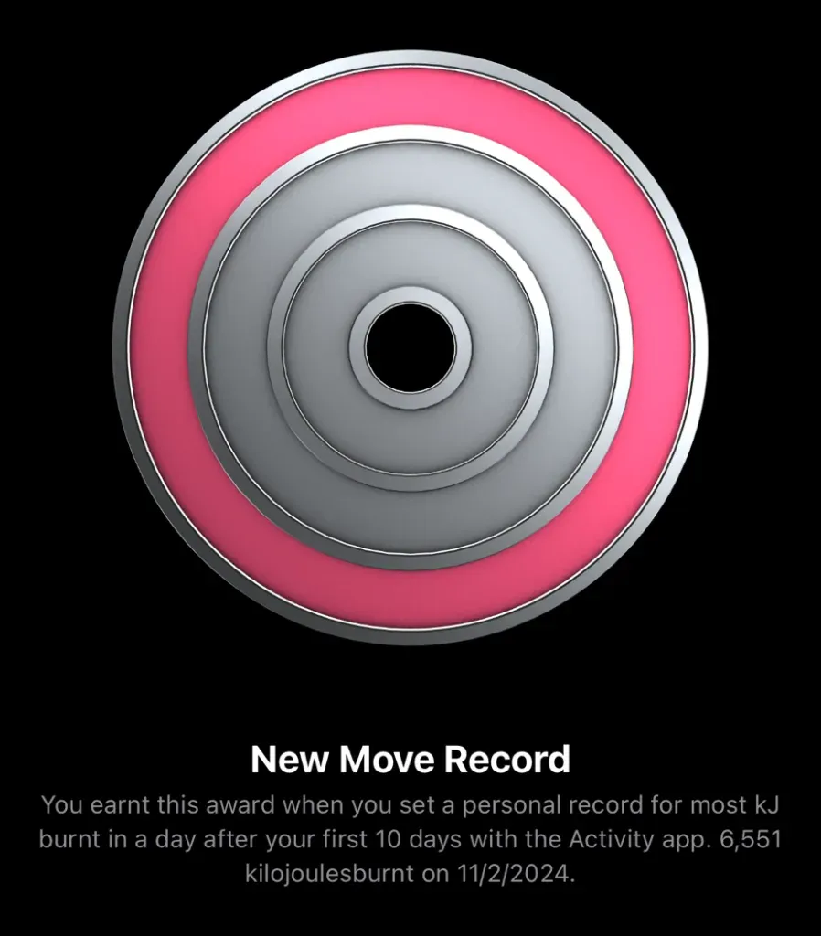 Apple Watch New Move Record award, concentric pink and silver rings, 6,551 kilojoules burnt on 11 February 2024