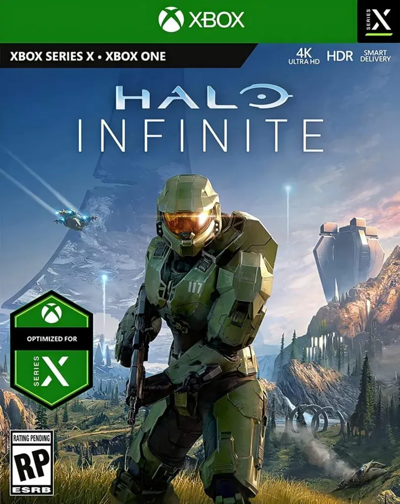 Halo Infinite Xbox box art, Master Chief crouched in grassland with the ring arcing through the sky behind